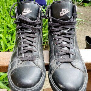 All black Nike mid tops